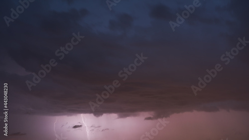 Evening sky storm clouds with lightning