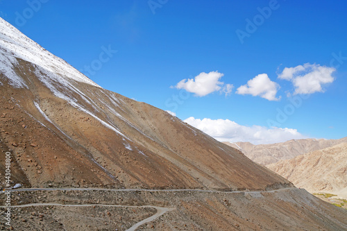 Landscape of Winding road along the snow mountain go to changla pass is a high mountain pass in Leh Ladakh  Jammu   Kashmir India. It is claimed to be the second highest motor-able road in the world  