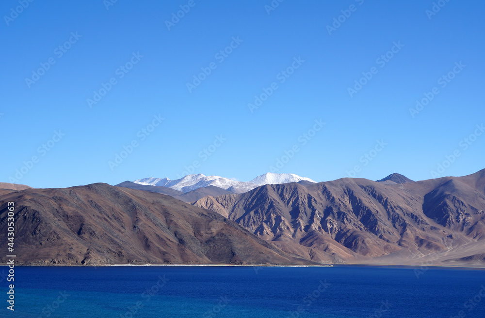Landscape  Nature Scene of Pangong tso or Pangong Lake with himalaya snow mountain background is best famous destination at Leh Ladakh ,Jammu and Kashmir , India                              