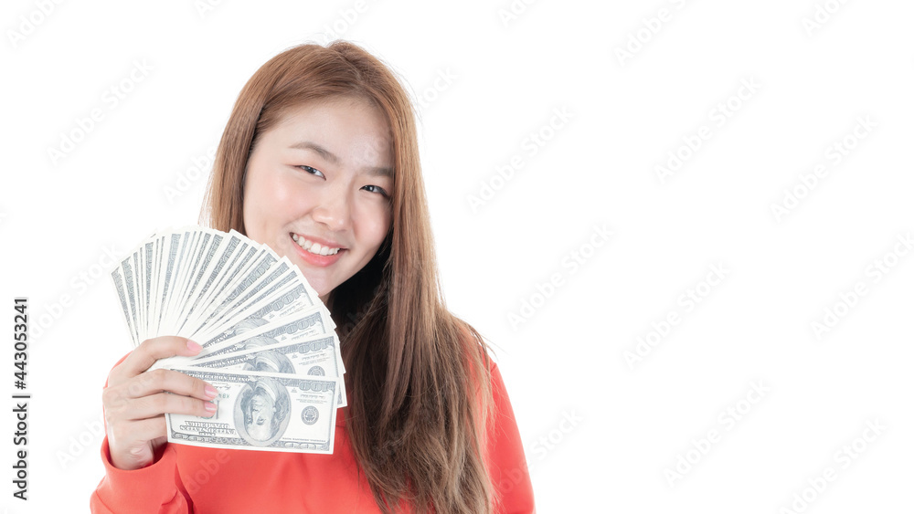 Successful beautiful Asian business young woman holding money US dollar bills in hand on white background , business concept Successful beautiful Asian business young woman holding money US dollar bills in hand on white background , business concept