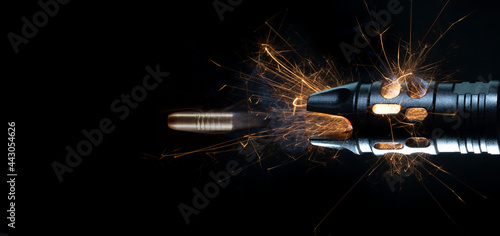 Copper bullet after leaving the barrel of an Ar-15 with smoke and sparks behind