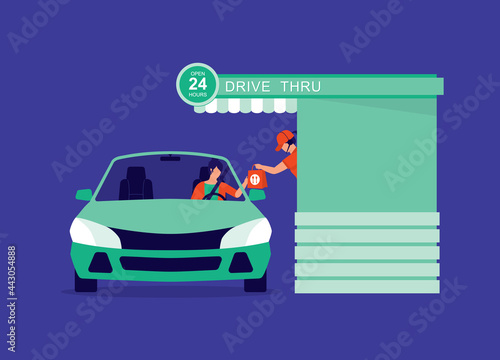 Woman Customer In Car Collecting Takeaway Food From Waitress At The Drive-Thru Fast Food Restaurant.