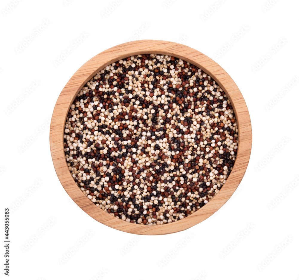 Dry tricolor quinoa in wooden bowl on white background Dry tricolor quinoa in wooden bowl on white background