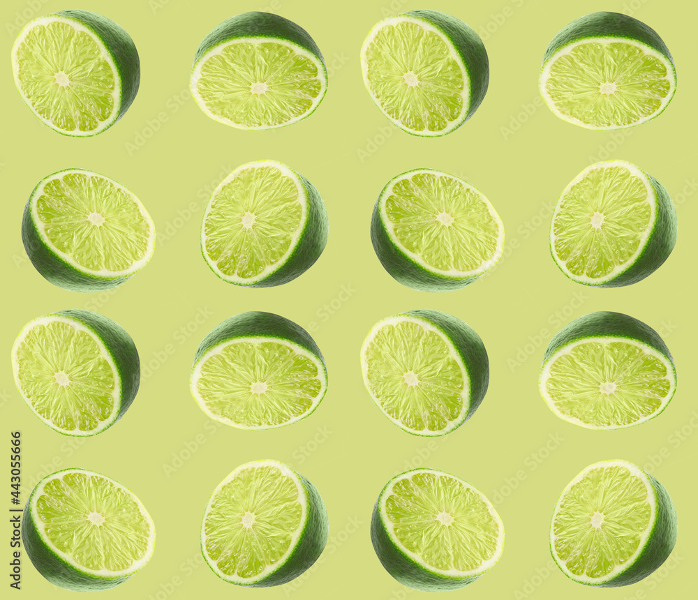 Halves of fresh limes on green background Halves of fresh limes on green background