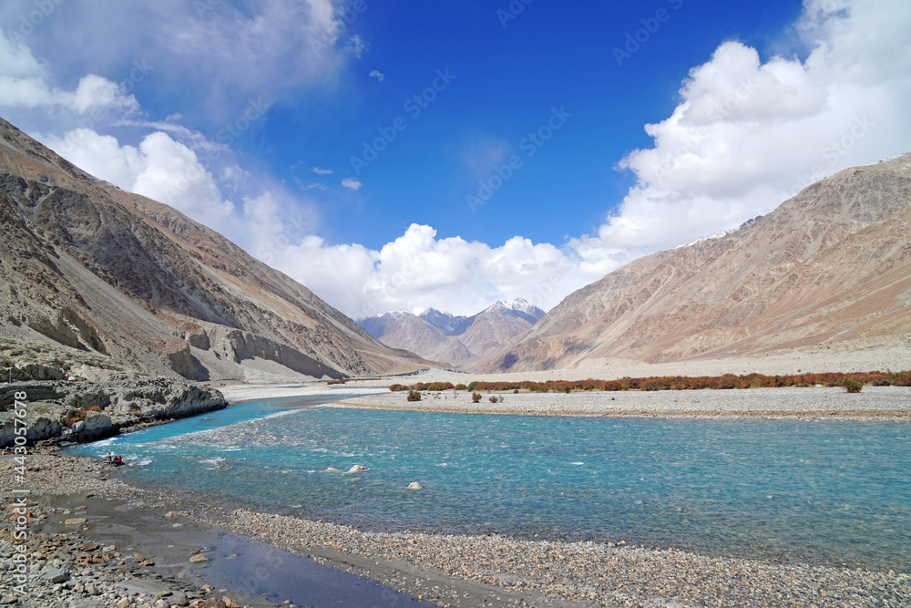 Beautiful Landscape of Shyok River is Clearly blue waterway on the hill with snow maountain background at Nubra Valley, Leh Ladakh, India