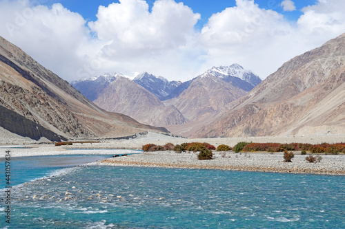 Beautiful Landscape of Shyok River is Clearly blue waterway on the hill with snow maountain background at Nubra Valley, Leh Ladakh, India photo