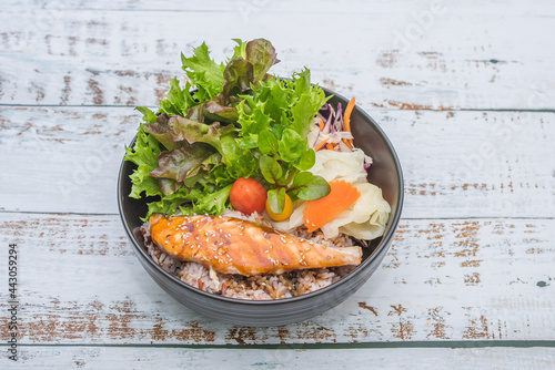 salad with salmon and vegetables. salmon with rice