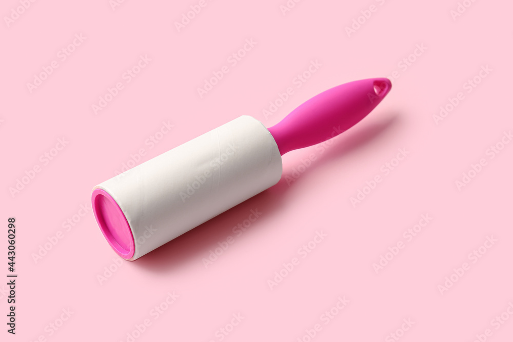 Lint roller on color background Lint roller on color background