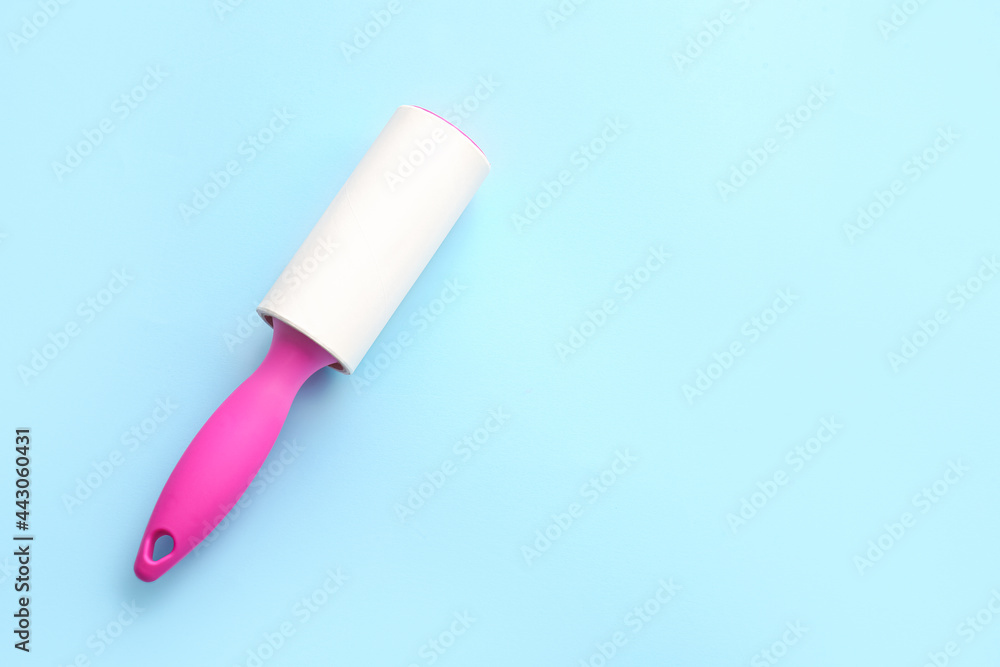 Lint roller on color background Lint roller on color background