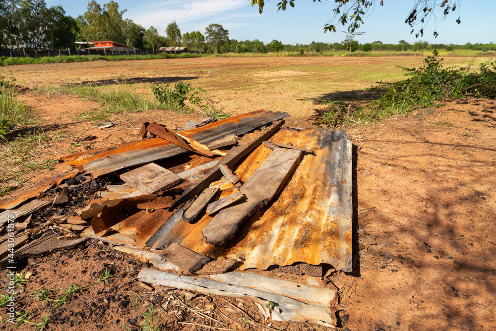 Old dilapidated zinc lay on the ground, outdoor. Old dilapidated zinc lay on the ground, outdoor.