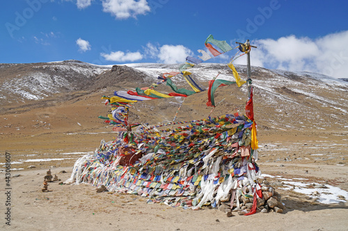 Many tibetan flag on the way with snow mountain background at Tso kar lake Leh Ladakh ,Jammu and Kashmir , India