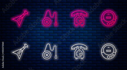Set line Yoyo toy, Telephone handset, Electric bass guitar and Music CD player. Glowing neon icon on brick wall. Vector
