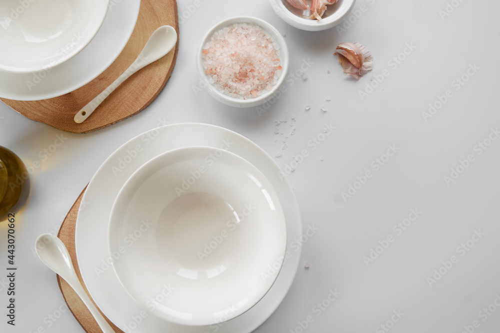 Empty white dishes on table, space for text Empty white dishes on table, space for text