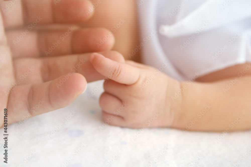 Newborn baby hand with father hand Newborn baby hand with father hand