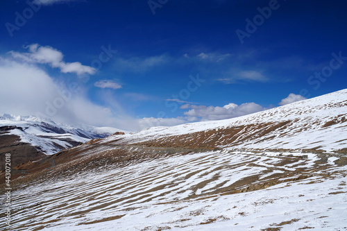 Landscape Natural Scene white Snow on the   himalaya snow mountain of High Roadway at tanglang la pass in winter season at Leh Ladakh , India photo