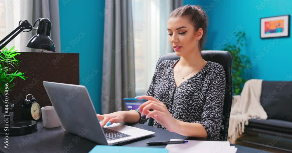 A young woman successfully buys airline tickets for a trip. A handsome student girl types in his credit card number on an online store website. A young woman makes an online purchase. A young woman successfully buys airline tickets for a trip. A handsome student girl types in his credit card number on an online store website. A young woman makes an online purchase.