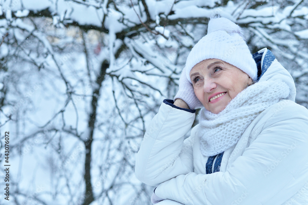Happy beautiful senior woman in warm hat Happy beautiful senior woman in warm hat