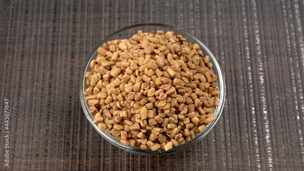 Organic fenugreek seeds, ingredient in Indian cuisine. Organic fenugreek seeds, ingredient in Indian cuisine.