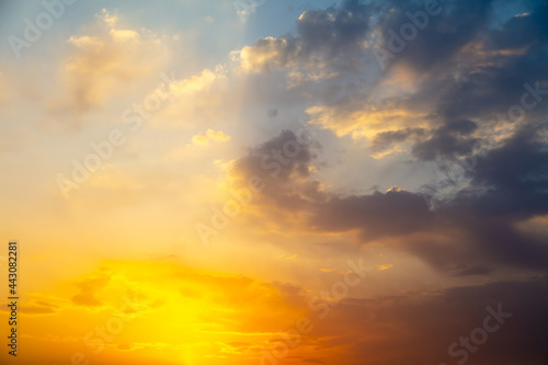 Golden sky with clouds at sunset
