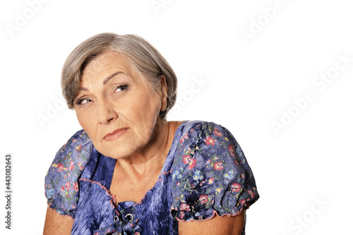 Portrait of suspicious beautiful senior woman posing isolated on white background