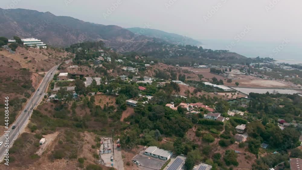 Aerial: Malibu coastline, pacific coast highway traffic and houses, Los Angeles, California, USA Aerial: Malibu coastline, pacific coast highway traffic and houses, Los Angeles, California, USA