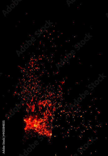 Sparks from fire on a black