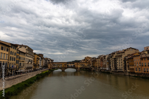 Ponte Vecchio, old bridge on the river in Florence with dramatic sky © rninov
