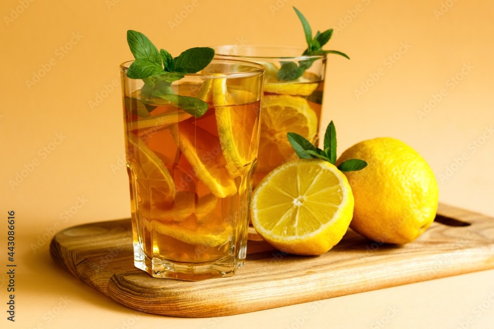 Delicious iced tea with lemon and mint in a glasses Delicious iced tea with lemon and mint in a glasses