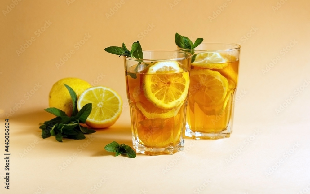 Delicious iced tea with lemon and mint in a glasses Delicious iced tea with lemon and mint in a glasses