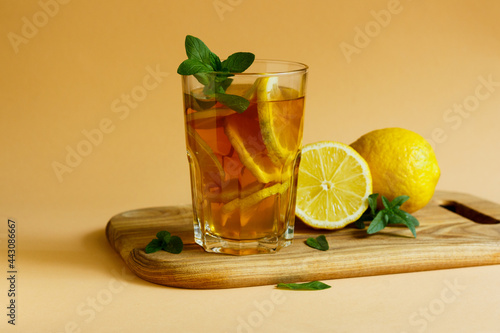 Refreshing Iced Tea Out Of Black Tea, Lemon Slices, Garnished With Fresh Mint Leaves