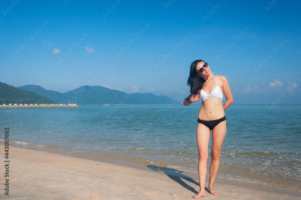chinese woman on a beach in penang malaysia