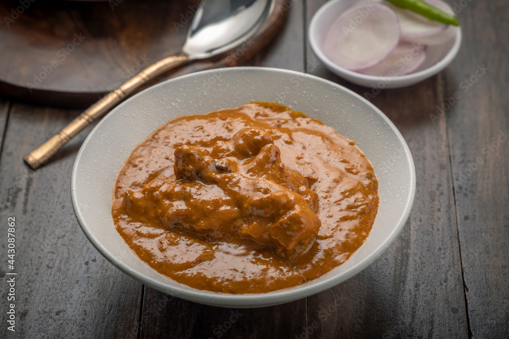 chicken butter masala served in a white bowl chicken butter masala served in a white bowl