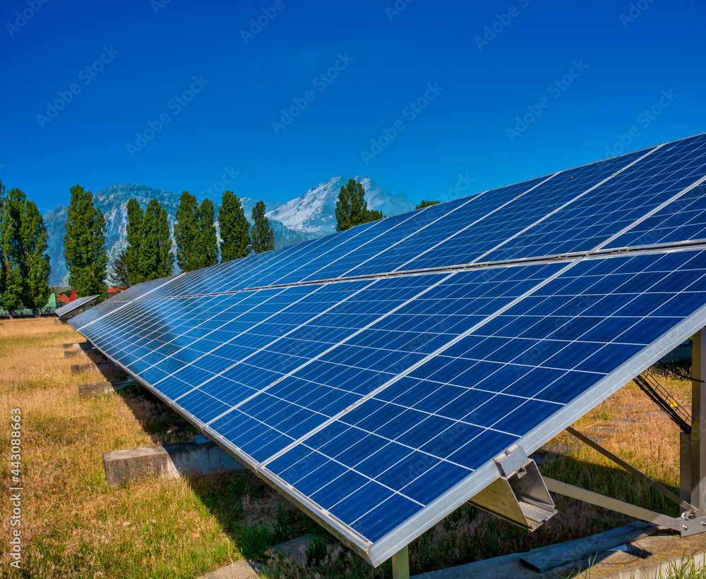Solar power plant producing sustainable electricity and renewable energy. Solar energy. Solar panels under a sunny sky.