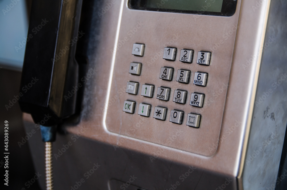 The number pad on a metal public pay phone. The number pad on a metal public pay phone.
