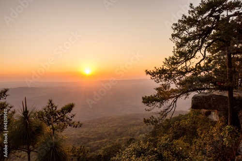 The sunset scenery on Phukradueng national park  Loey  Thailand. This is one of the landscape nature mountain scene. Taken in warm filter and soft focus effect.
