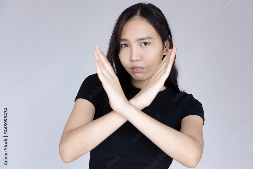 woman saying no with rejecting hand gesture and negative facial expression woman saying no with rejecting hand gesture and negative facial expression