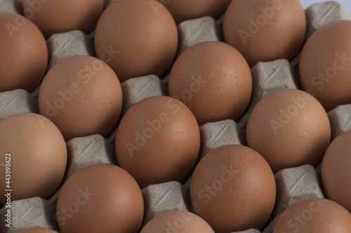 A bunch of eggs with corrugate box and bowl with natural morning light