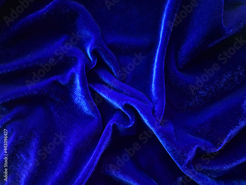 Blue velvet fabric texture used as background. Empty Bluefabric background of soft and smooth textile material. There is space for text.