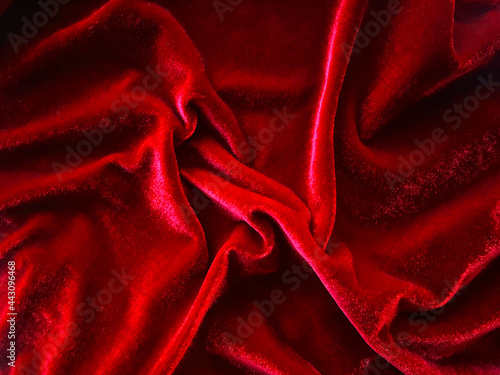 Red velvet fabric texture used as background. Empty red fabric background of soft and smooth textile material. There is space for text.