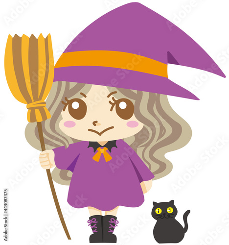 魔女の仮装をして微笑む女の子と黒猫