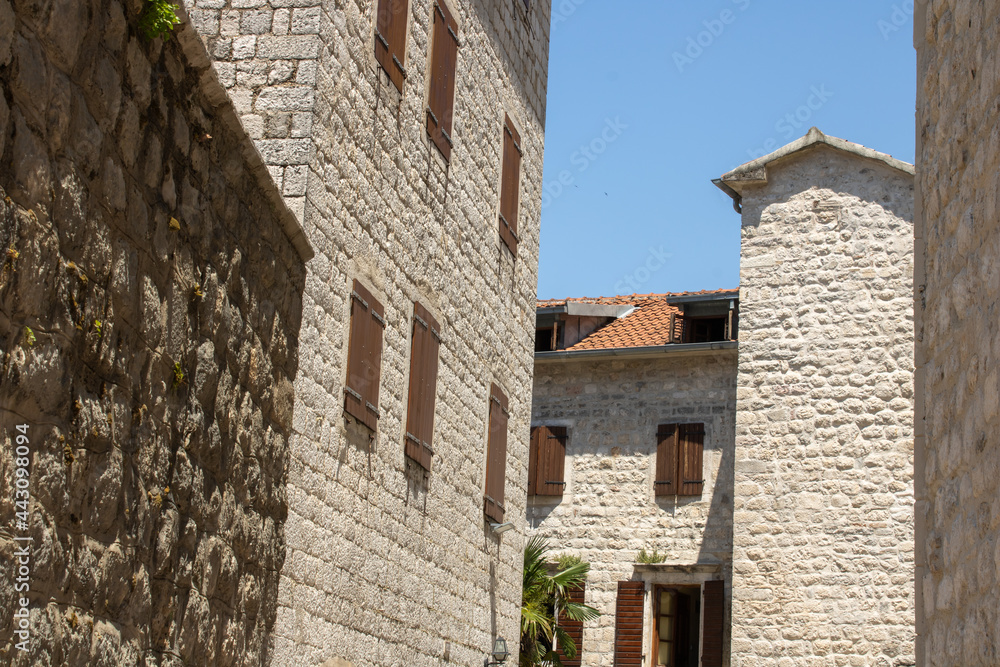 Medieval buildings. Old town of Kotor Montenegro on the background blue sky. 