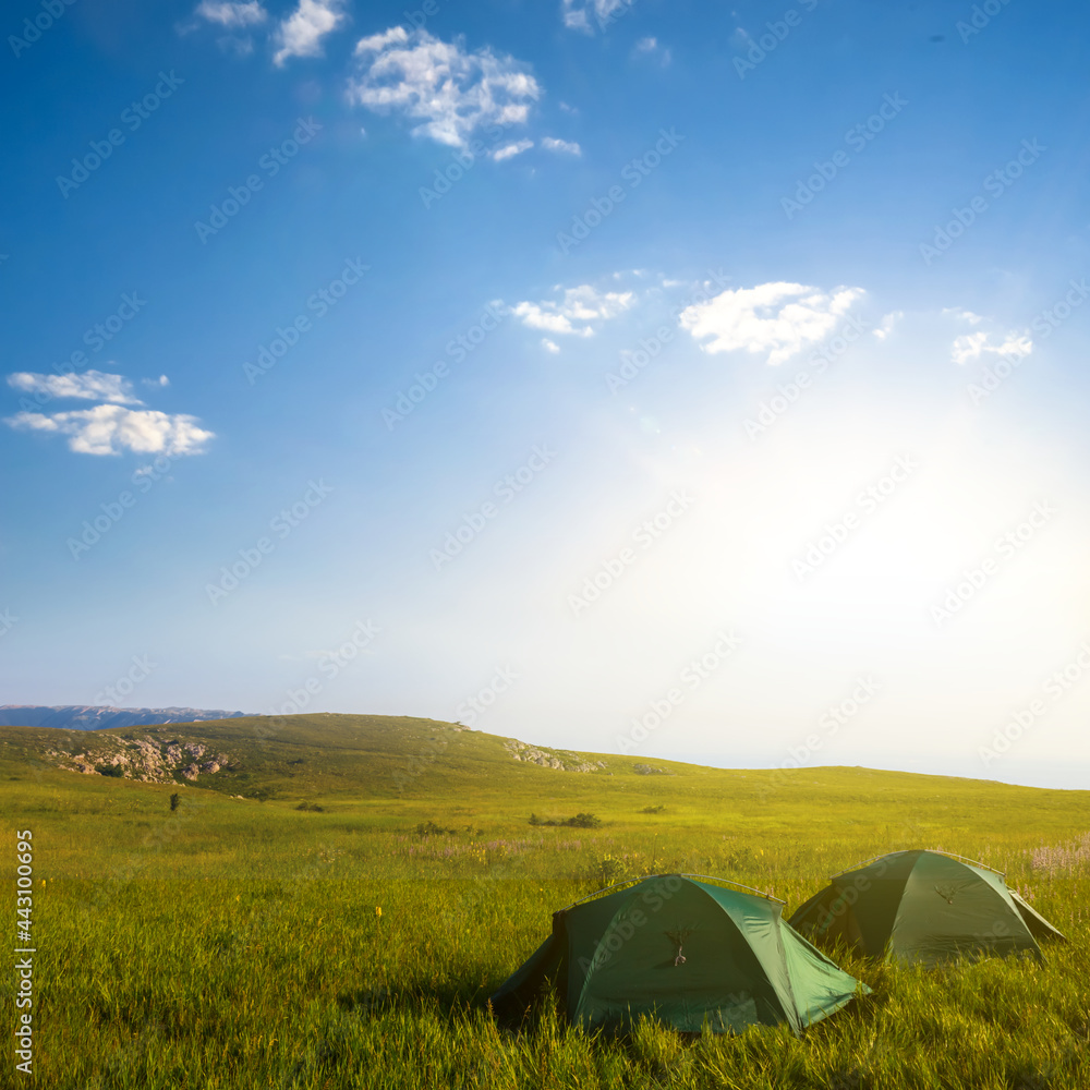 touristic camp stay on mountain plateau at the early morning, natural hiking scene
