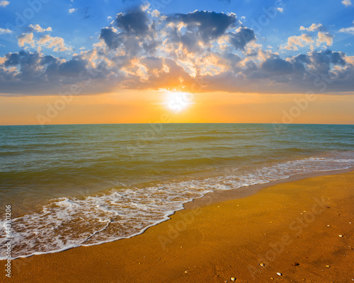 sandy emerald sea beach at the dramatic sunset   summer sea vacation background