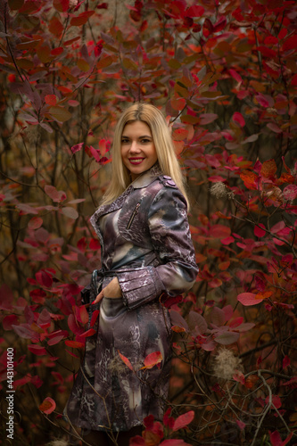 beautiful girl in autumn beautiful foliage in the forest in the tunnel