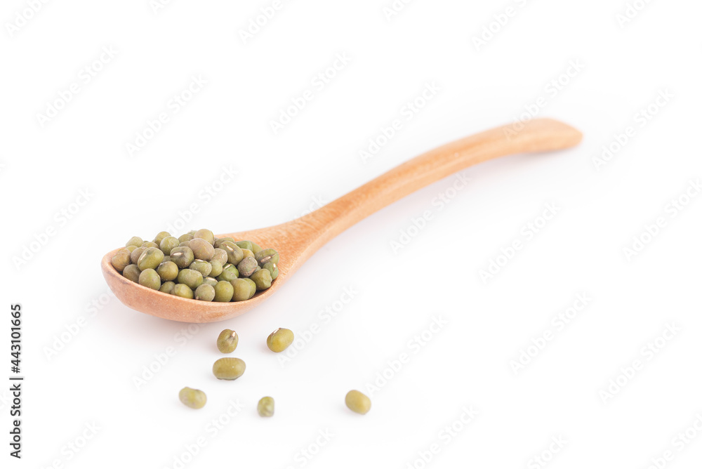 Mung beans in a wooden spoon isolated on white background. Mung beans in a wooden spoon isolated on white background.