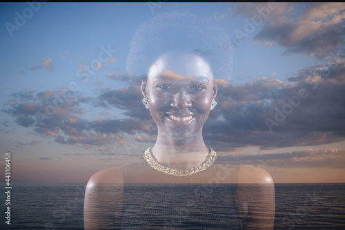 Multiple exposure image with clouds and sky inside positive smiling african american woman portrait. Mental health and Christianity concept.