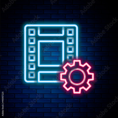 Glowing neon line Play Video icon isolated on brick wall background. Film strip sign. Colorful outline concept. Vector