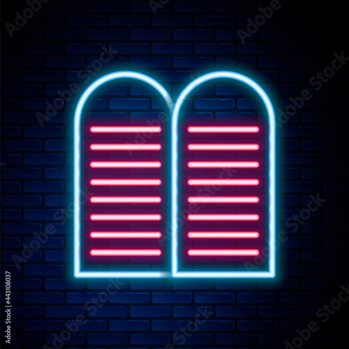 Glowing neon line The commandments icon isolated on brick wall background. Gods law concept. Colorful outline concept. Vector