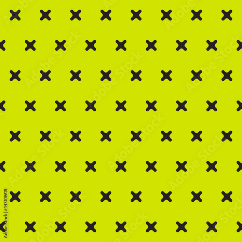 Yellow background and black crosses pattern. Vector seamless and repoeated little crosses.
