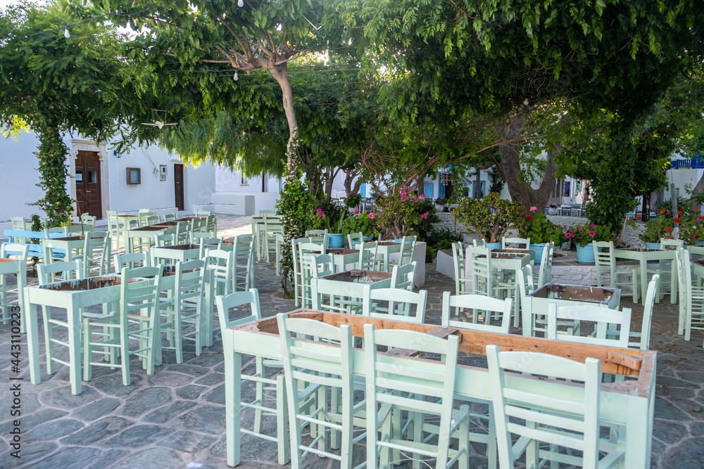 Greek island outdoor tavern tables, sunny day